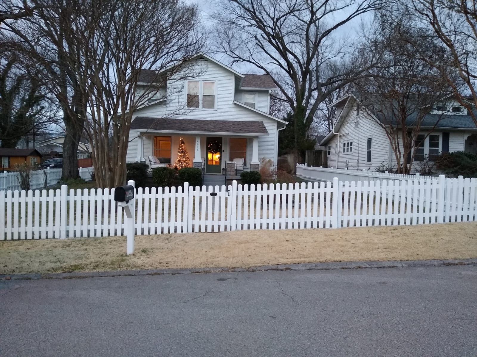 Nashville home with freshly painted white picket fence